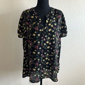 Black flowered blouse.